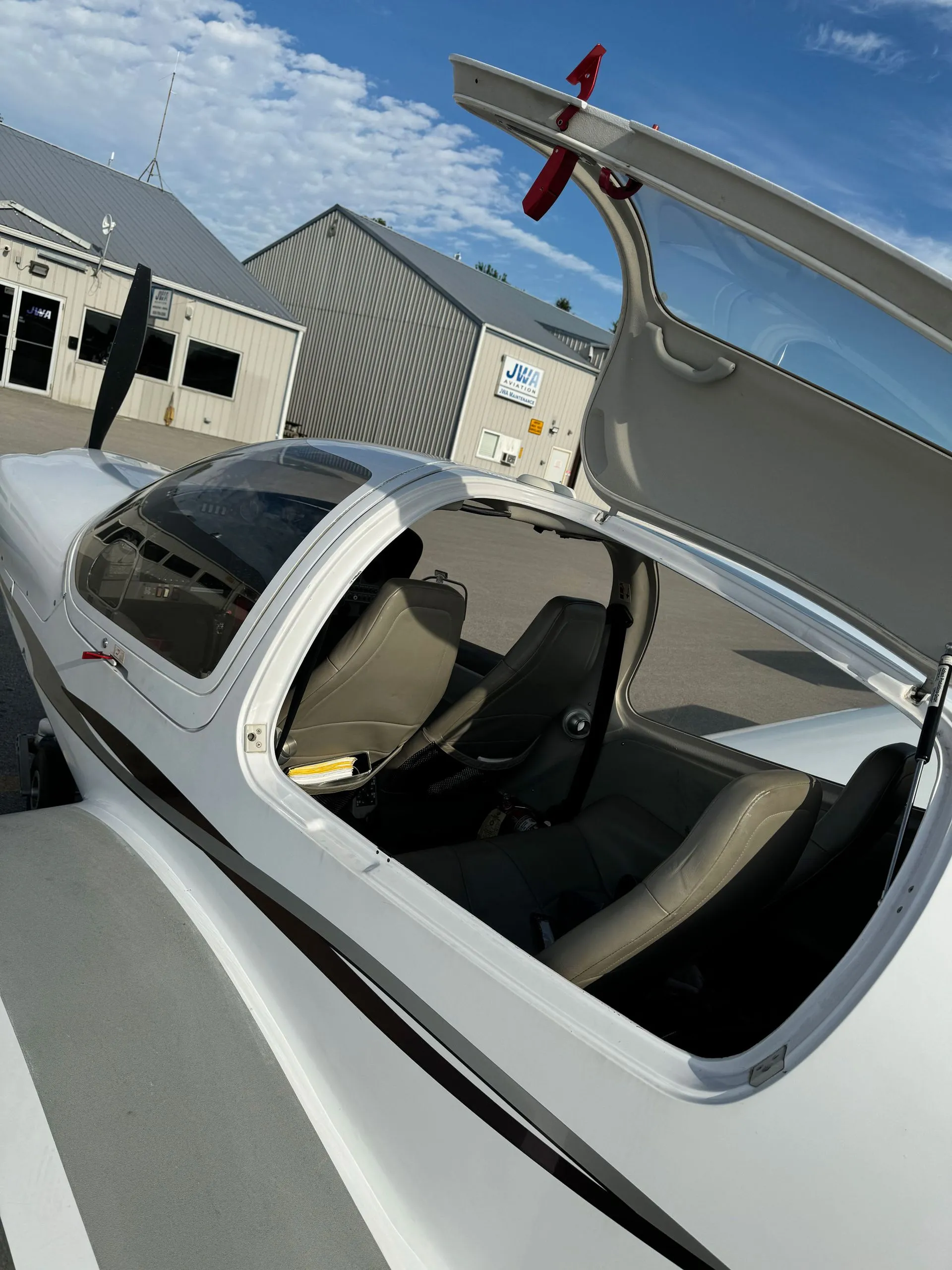 Diamond with canopy open outside the JWA hangar